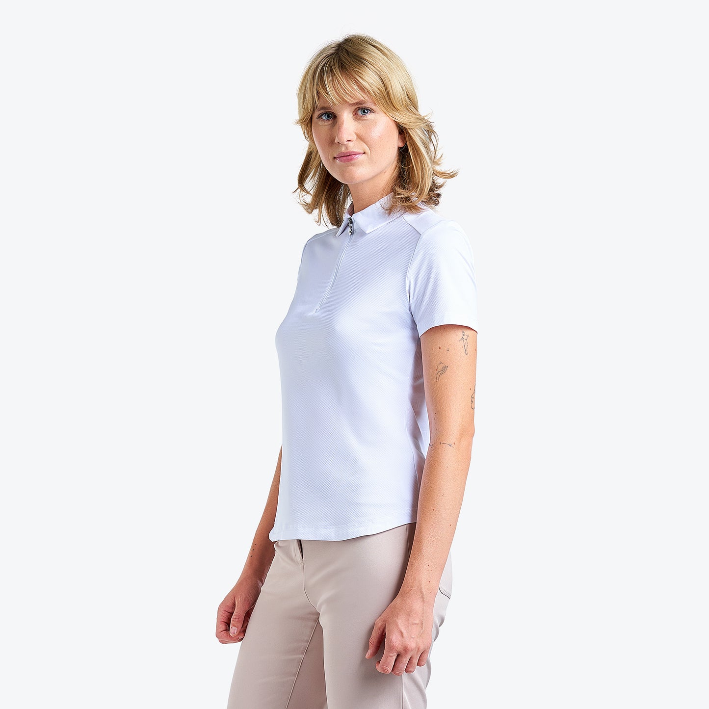 Nivo Naila Liv Cool Short Sleeve Polo Shirt in White Side Facing Product Image